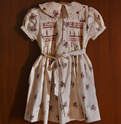 Floral dress with embroidery on a wooden background